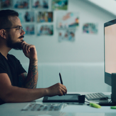 A man is working on desktop